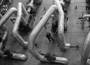 Men Working around pipes
